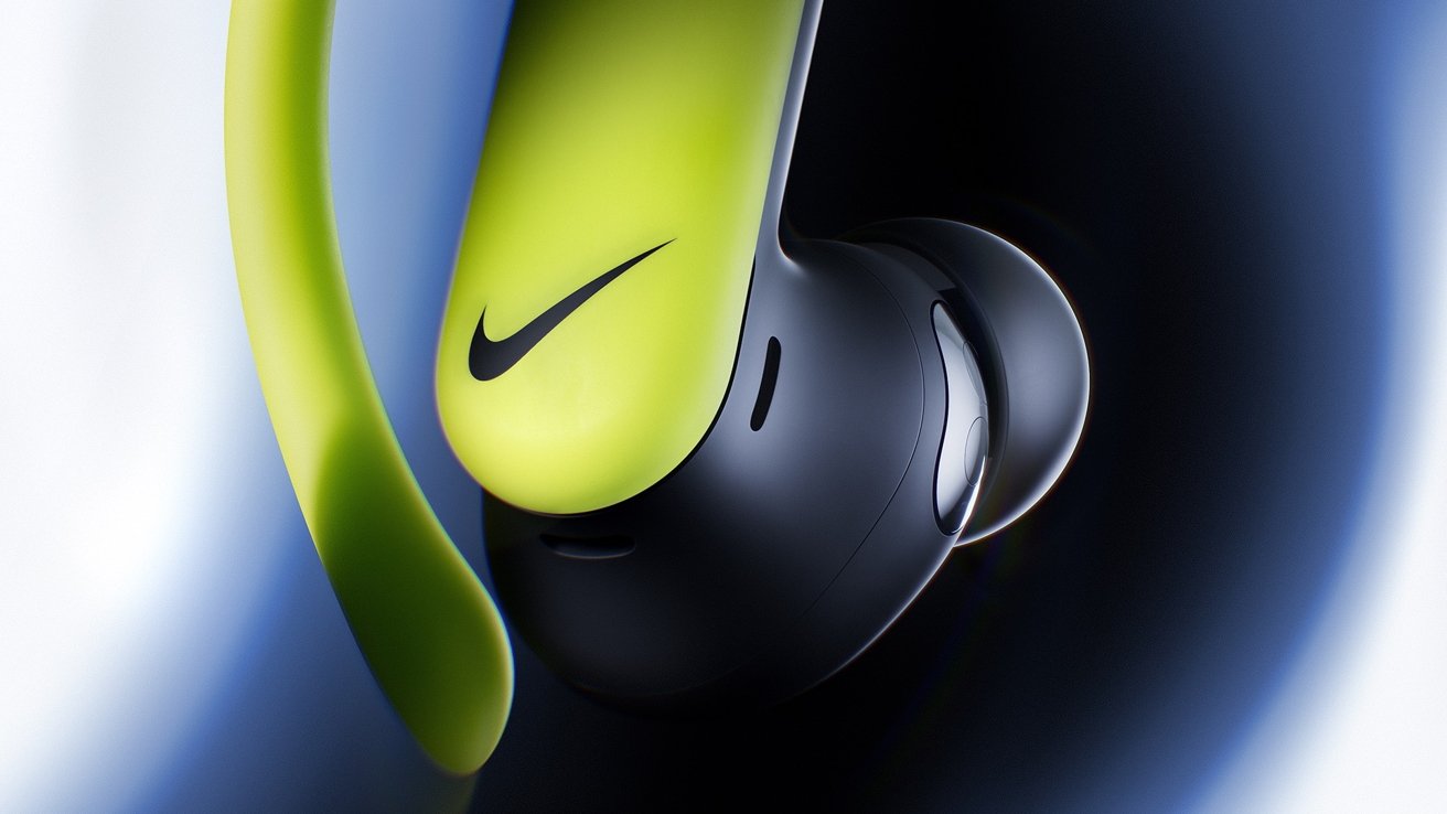 Close-up of a sleek neon yellow and black wireless earbud with a soft silicone tip, showing a curved ear hook and minimalist logo on a blurred dark blue background