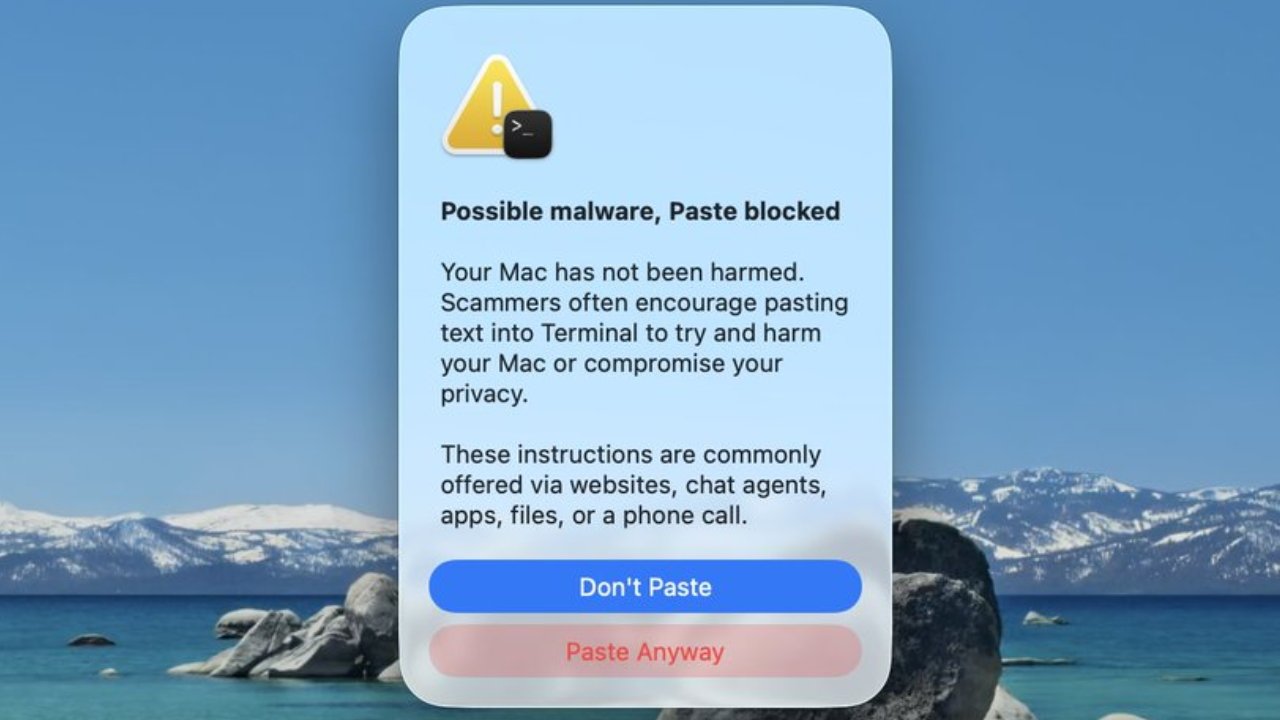 macOS warning dialog saying Possible malware, Paste blocked, explaining scammers misuse Terminal, over a scenic desktop background of a lake, rocks, and snowcapped mountains, with Dont Paste and Paste Anyway buttons
