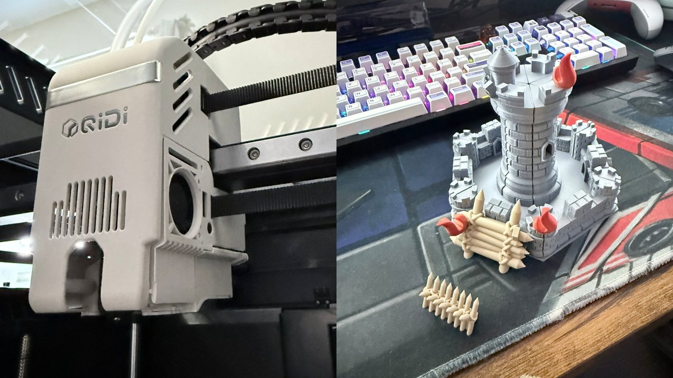 Side by side view of a Qidi 3D printer head and a gray 3D printed fantasy castle tower with walls and flames on a desk beside a colorful mechanical keyboard