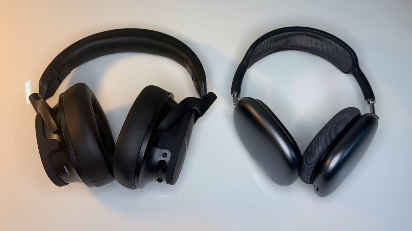 Two black over-ear headphones on a white surface; left pair bulkier with attached microphone boom, right pair sleeker with thin mesh headband and oval ear cups